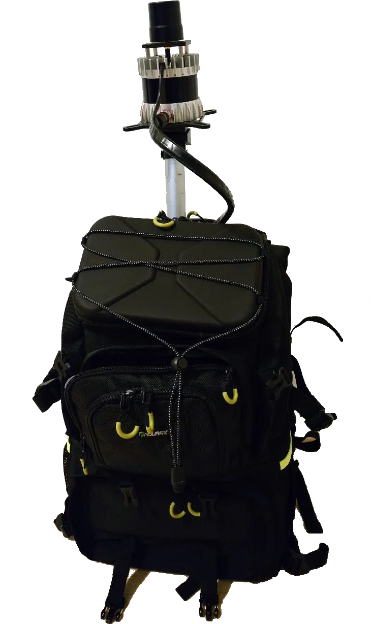 The backpack scanner: an Ouster LiDAR on a mast above a black backpack carrying the compute unit and battery.